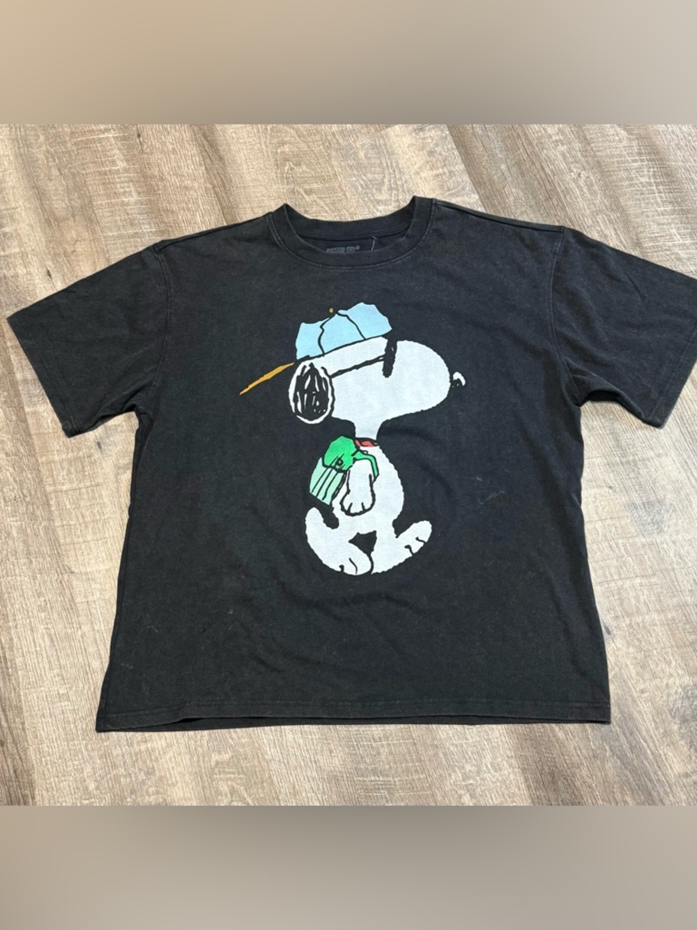 Snoopy Black Graphic Tee with Blue Cap and Green Backpack men’s large